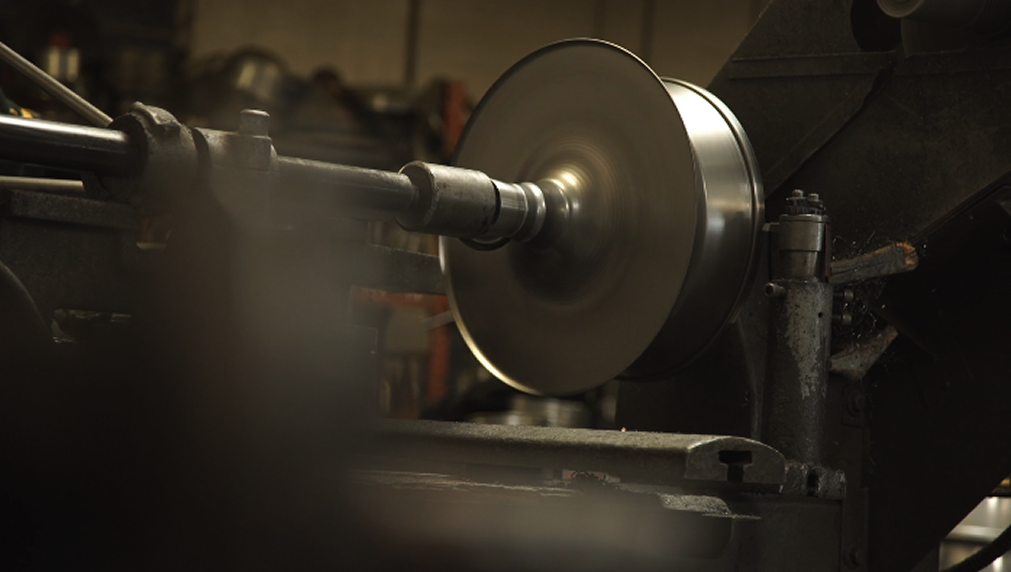 Traditional hand spinning process for Steel Lighting Co. domes in 2018